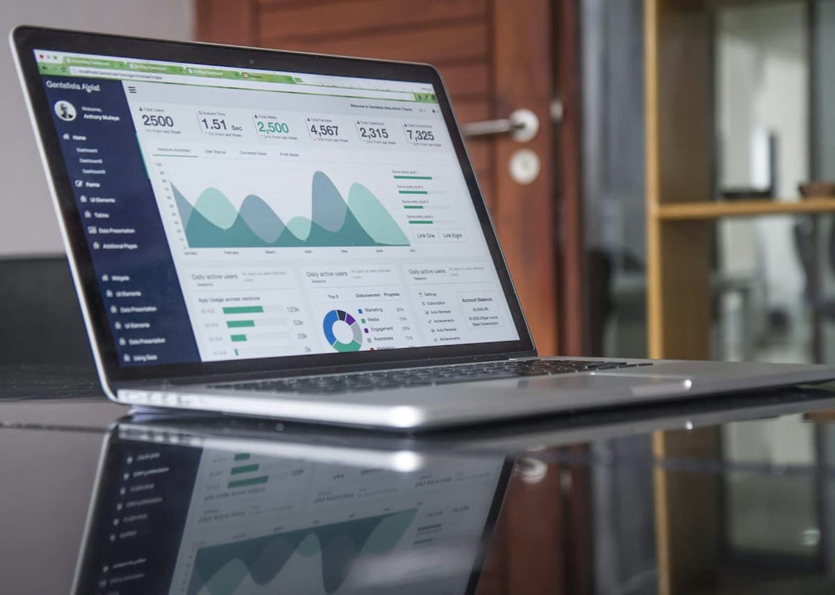 Campaign analytics on a laptop during media strategy planning